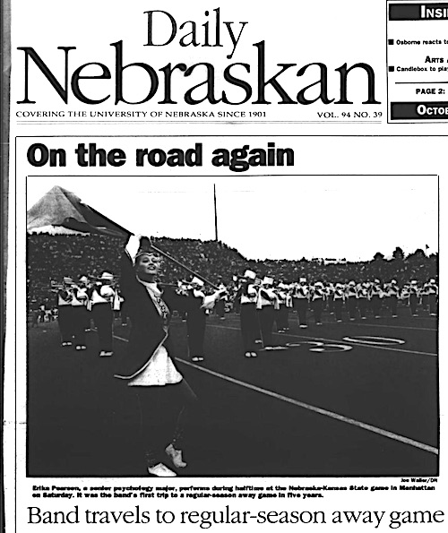Daily Nebraskan front page with photo of the band performing with headline Band travels to regular-season away game